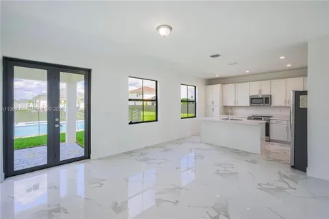 a view of a kitchen with windows