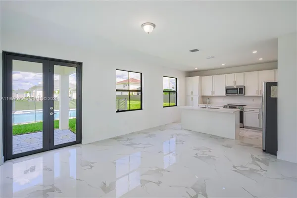 a view of a kitchen with windows