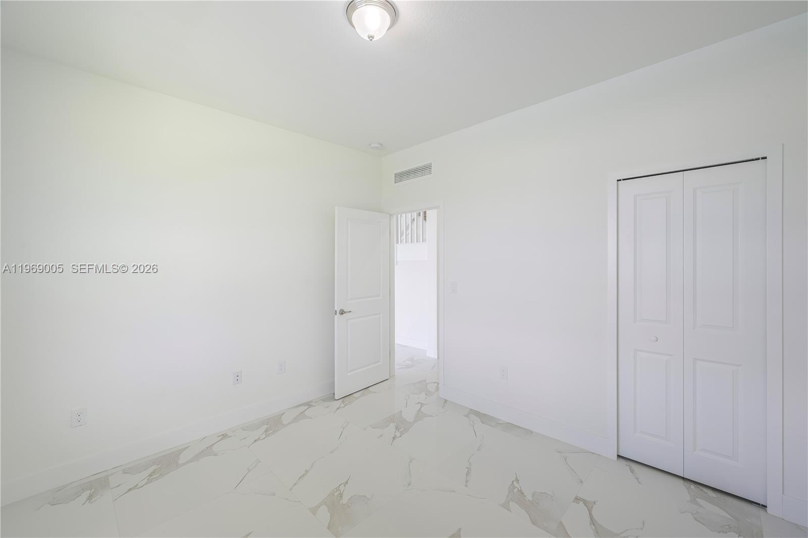 32242 Southwest 194th Avenue Homestead, FL 33030 - Photo 12 of 42 a view of an empty room