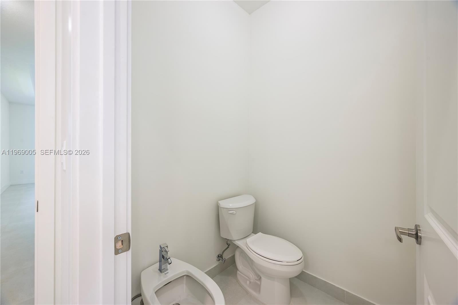 32242 Southwest 194th Avenue Homestead, FL 33030 - Photo 23 of 42 a white toilet sitting next to a shower