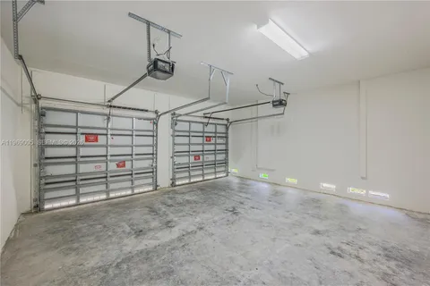 a view of house with yard and deck