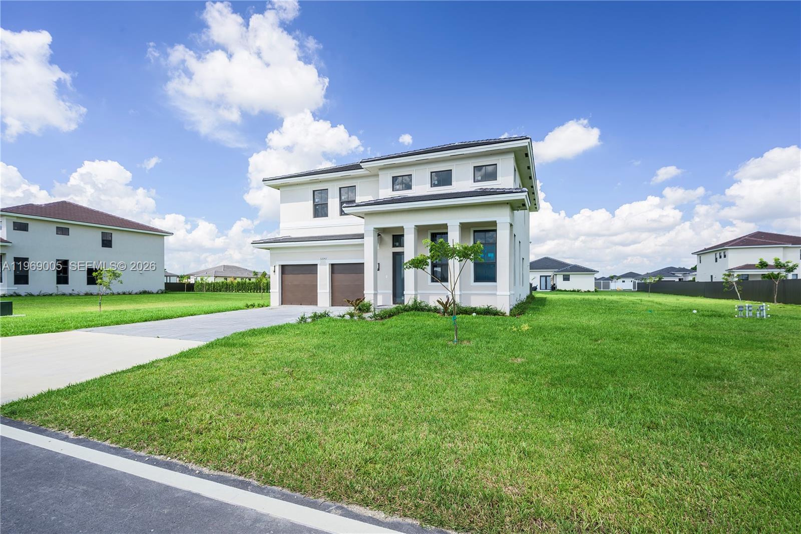 32242 Southwest 194th Avenue Homestead, FL 33030 - Photo 5 of 42 a view of house with yard