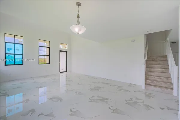 a view of an empty room with a window