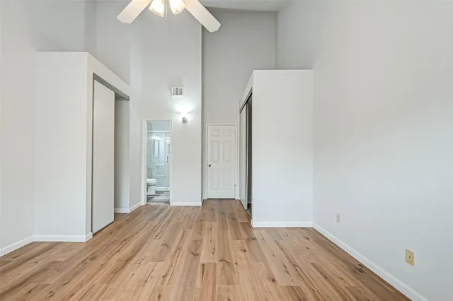 a view of a room with wooden floor