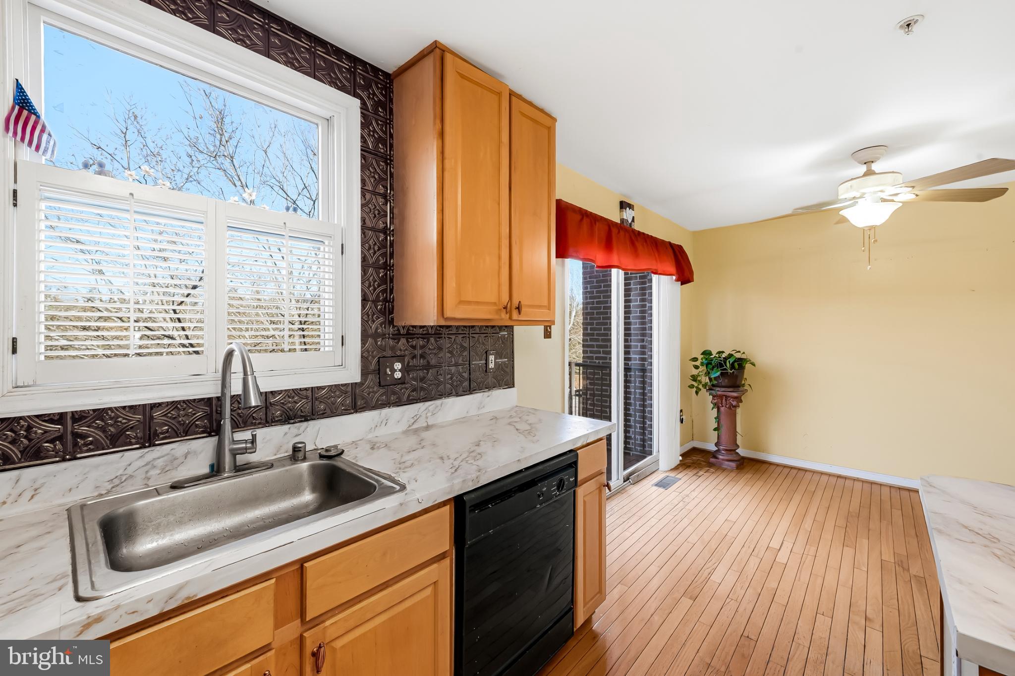 252 Robert Street Baltimore, MD 21217 - Photo 19 of 51 a kitchen with a sink a counter top space and cabinets