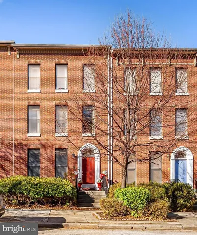 a front view of a building with garden