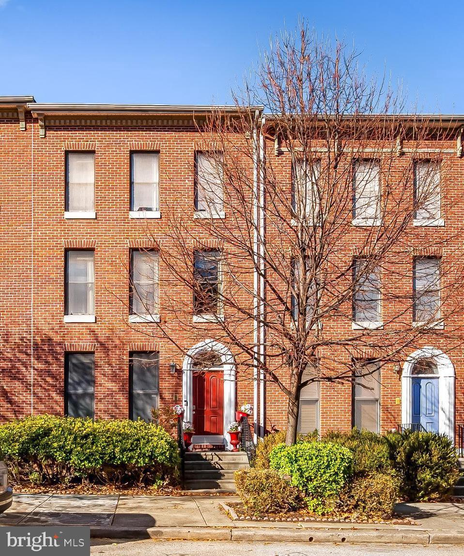 252 Robert Street Baltimore, MD 21217 - Photo 2 of 51 a front view of a building with garden