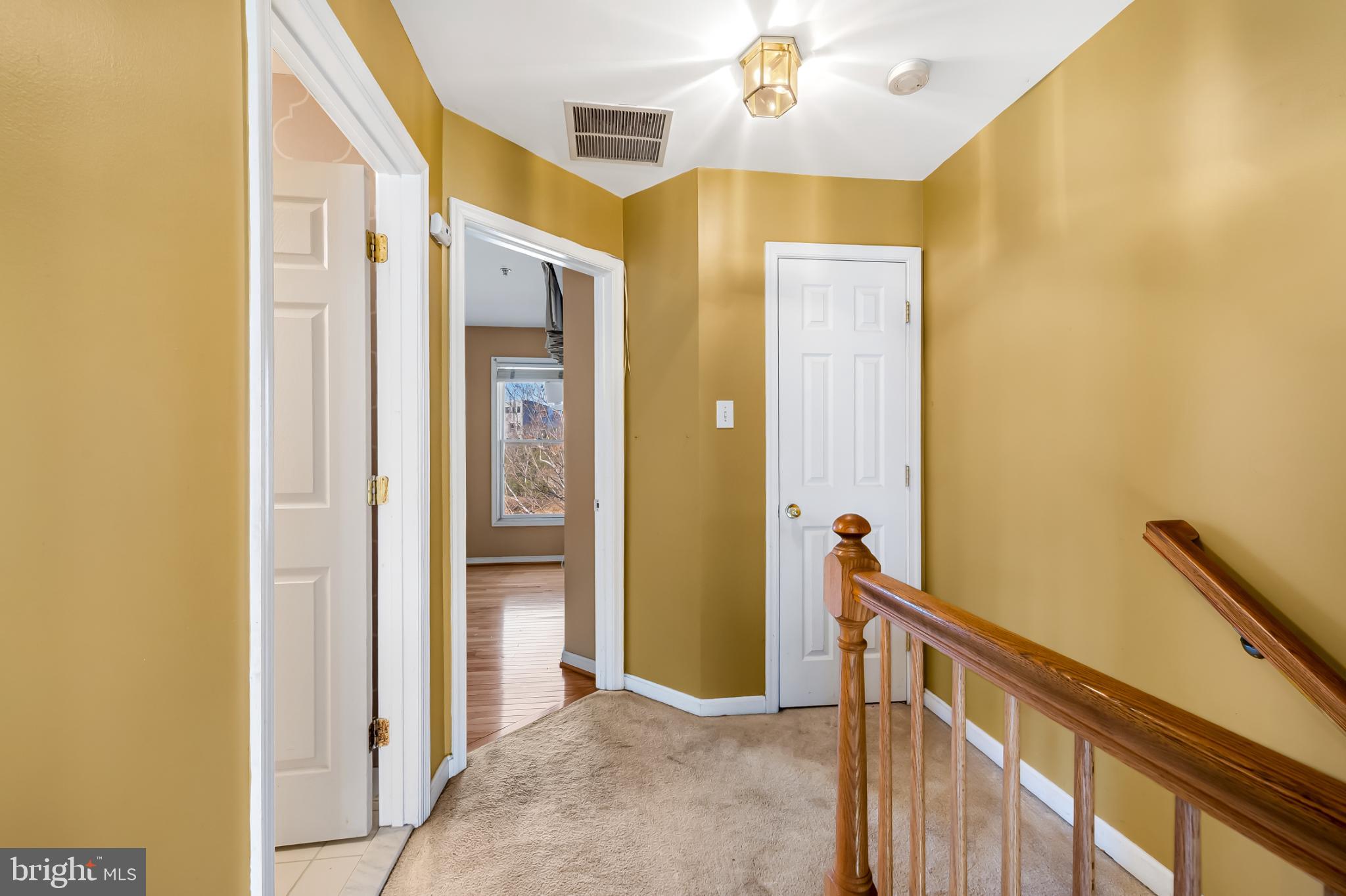 252 Robert Street Baltimore, MD 21217 - Photo 24 of 51 a view of a hallway with wooden floor and staircase