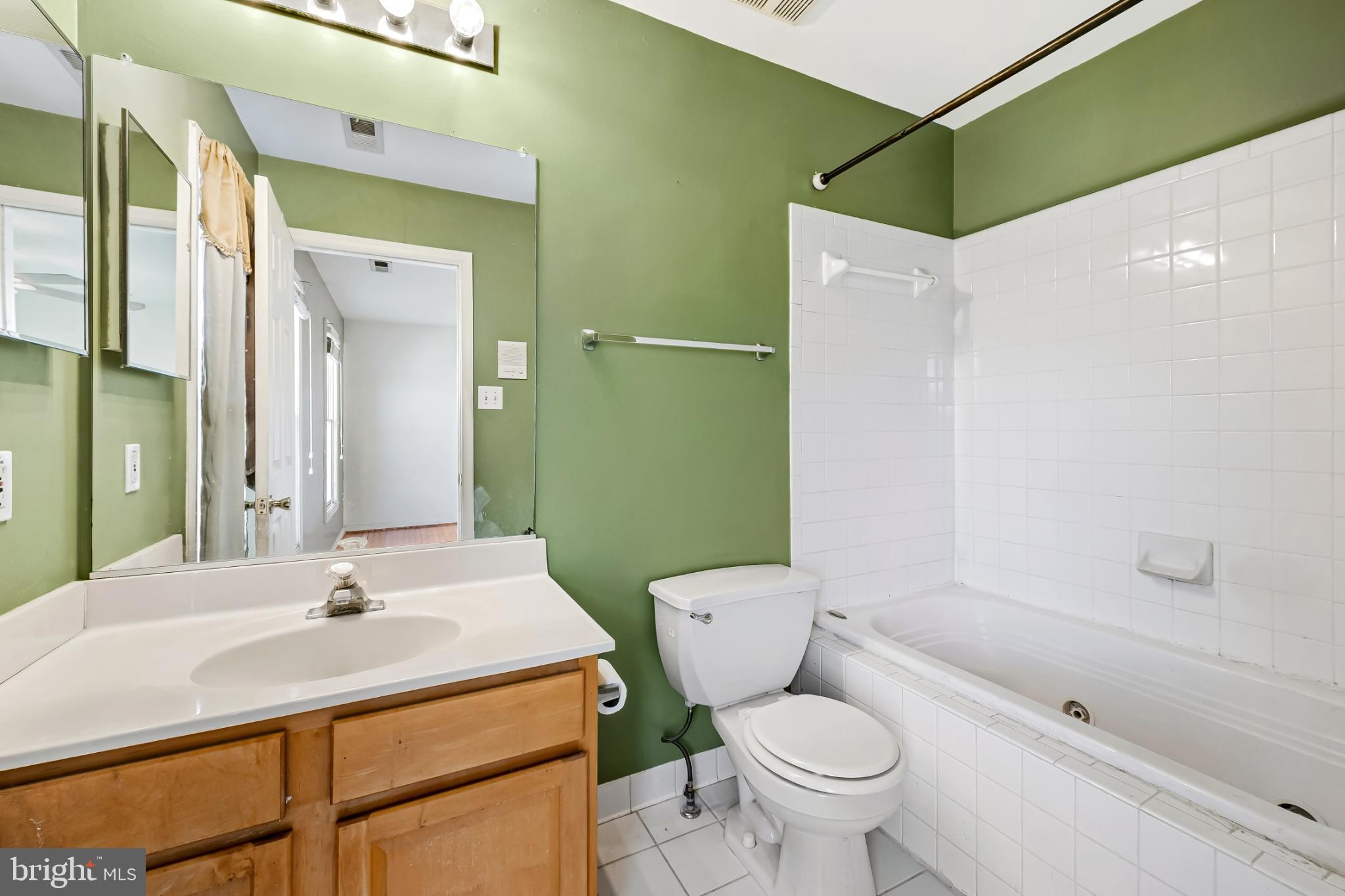 252 Robert Street Baltimore, MD 21217 - Photo 29 of 51 a bathroom with a sink toilet and shower