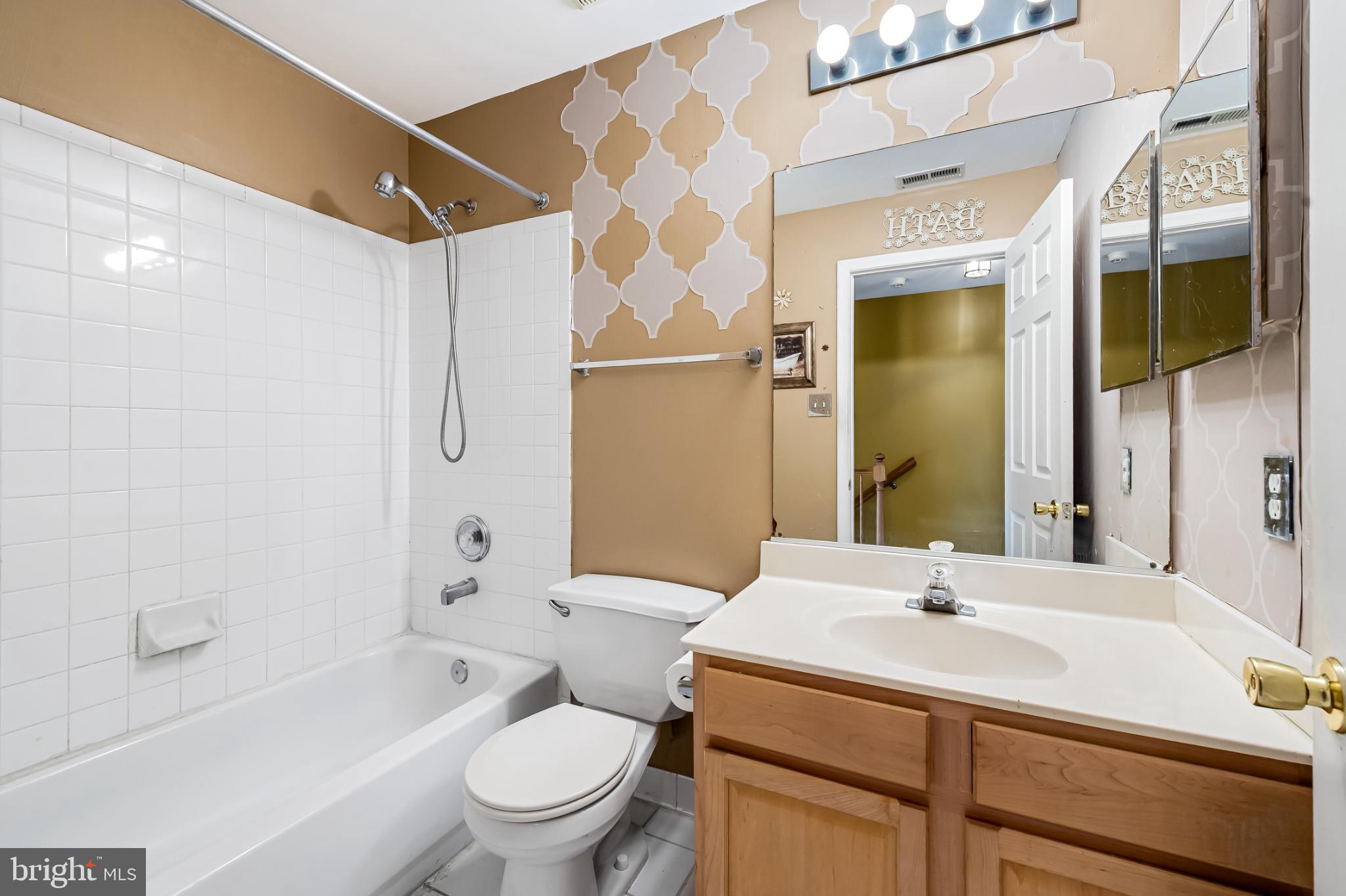 252 Robert Street Baltimore, MD 21217 - Photo 33 of 51 a bathroom with a sink toilet and shower