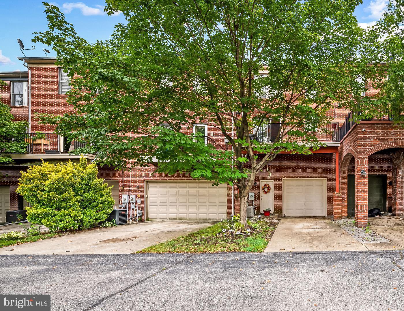252 Robert Street Baltimore, MD 21217 - Photo 46 of 51 a front view of a house with a yard and a garage