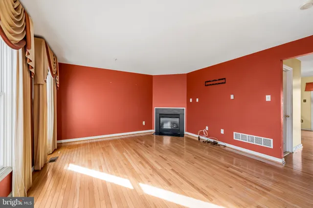 a kitchen with a stove a sink a microwave a refrigerator and cabinets