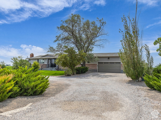 678 East 2000th Street South Delta, UT 84624 - Photo 1 of 1 Obstructed view of property with driveway and a garage