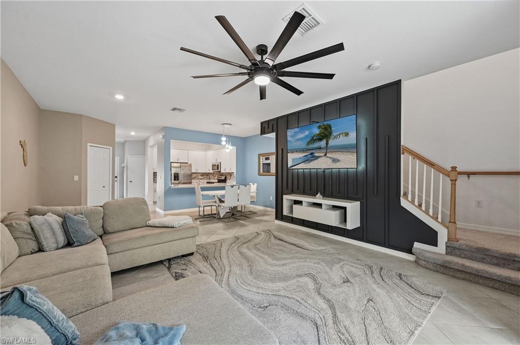 2828 Citrus Street Naples, FL 34120 - Photo 12 of 40 a living room with furniture and a flat screen tv