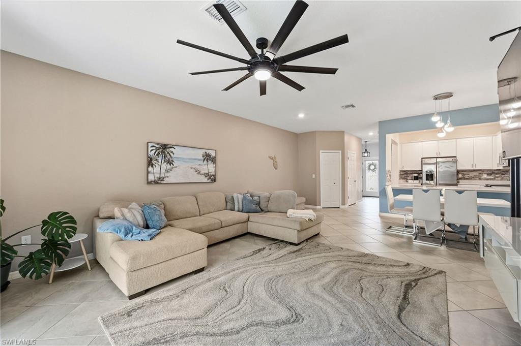 2828 Citrus Street Naples, FL 34120 - Photo 13 of 40 a living room with furniture and a view of kitchen