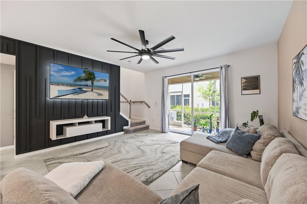2828 Citrus Street Naples, FL 34120 - Photo 15 of 40 a living room with furniture and a large window