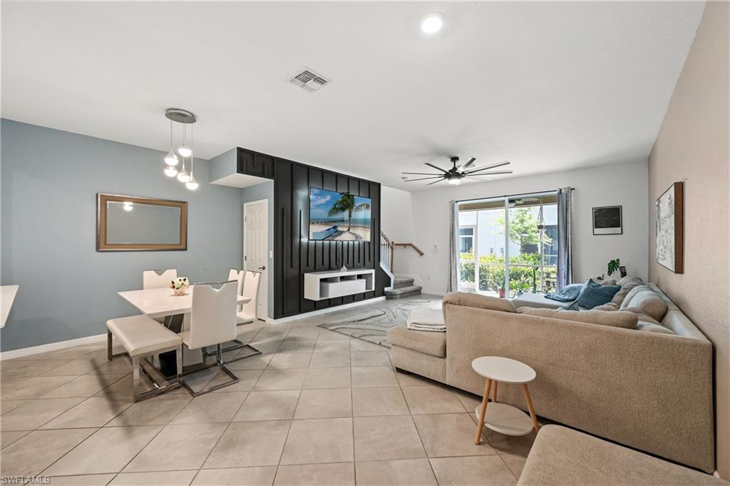 2828 Citrus Street Naples, FL 34120 - Photo 16 of 40 a living room with furniture and a large window