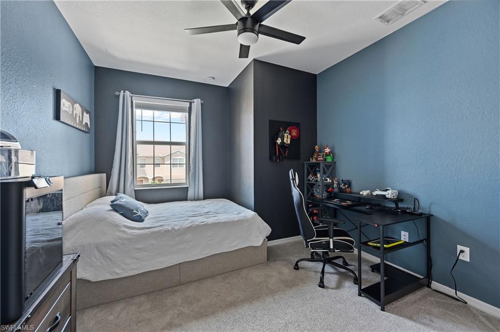 2828 Citrus Street Naples, FL 34120 - Photo 23 of 40 a bedroom with a bed and a table