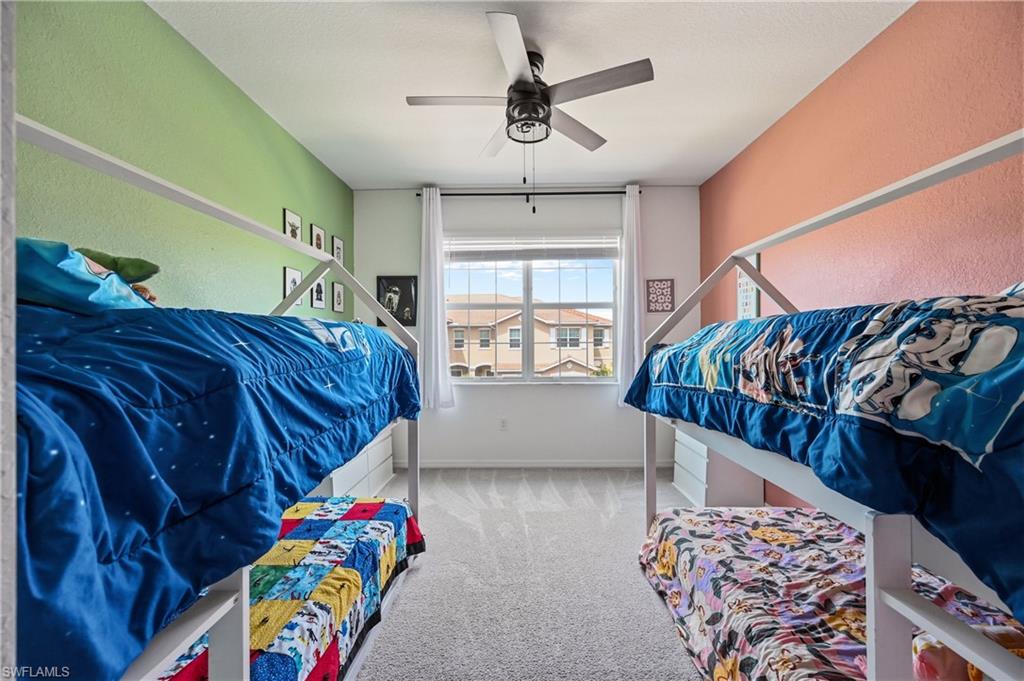 2828 Citrus Street Naples, FL 34120 - Photo 27 of 40 a view of a bedroom with furniture and windows