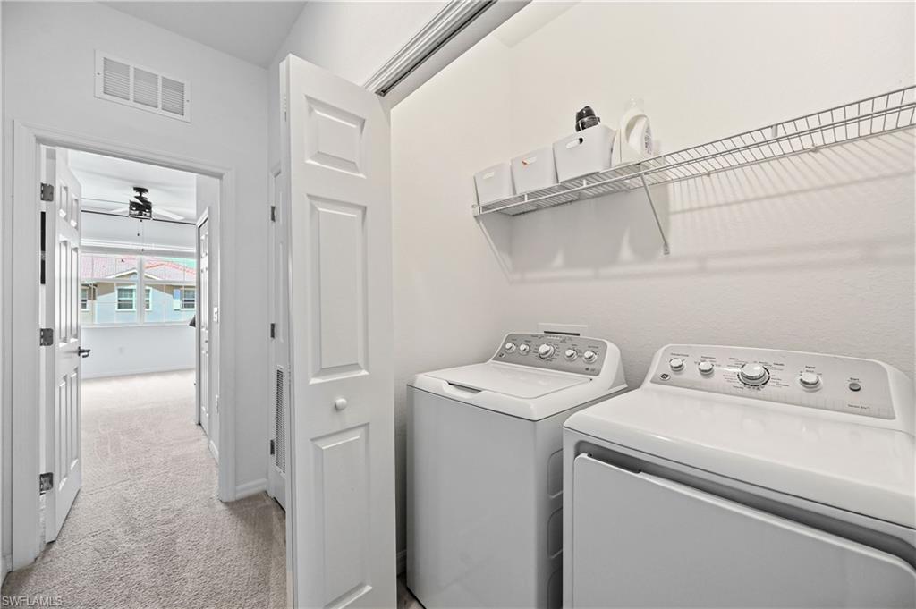 2828 Citrus Street Naples, FL 34120 - Photo 30 of 40 a view of storage and utility room with washer and dryer