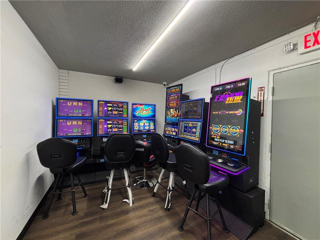 64 McNeal Road Winder, GA 30680 - Photo 12 of 12 a view of a workspace with furniture and wooden floor