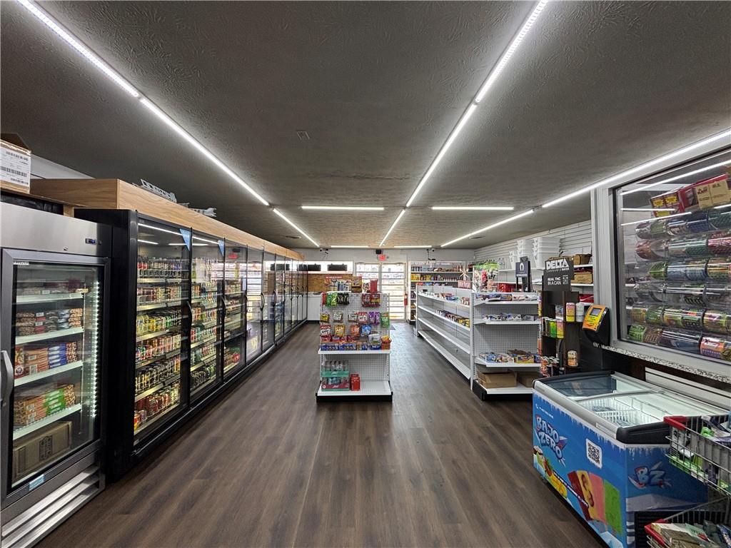 64 McNeal Road Winder, GA 30680 - Photo 3 of 12 a storage room with water heater and racks