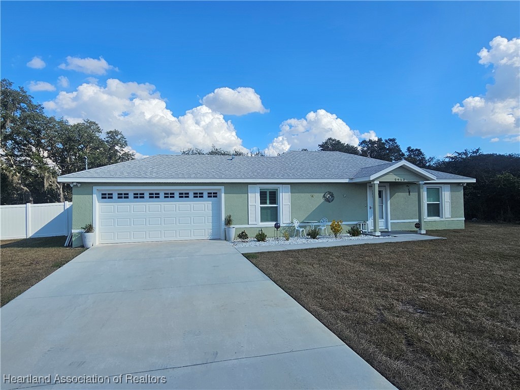 2950 North Sedgewick Road Avon Park, FL 33825 - Photo 1 of 16 a view of a house with a yard and sitting area