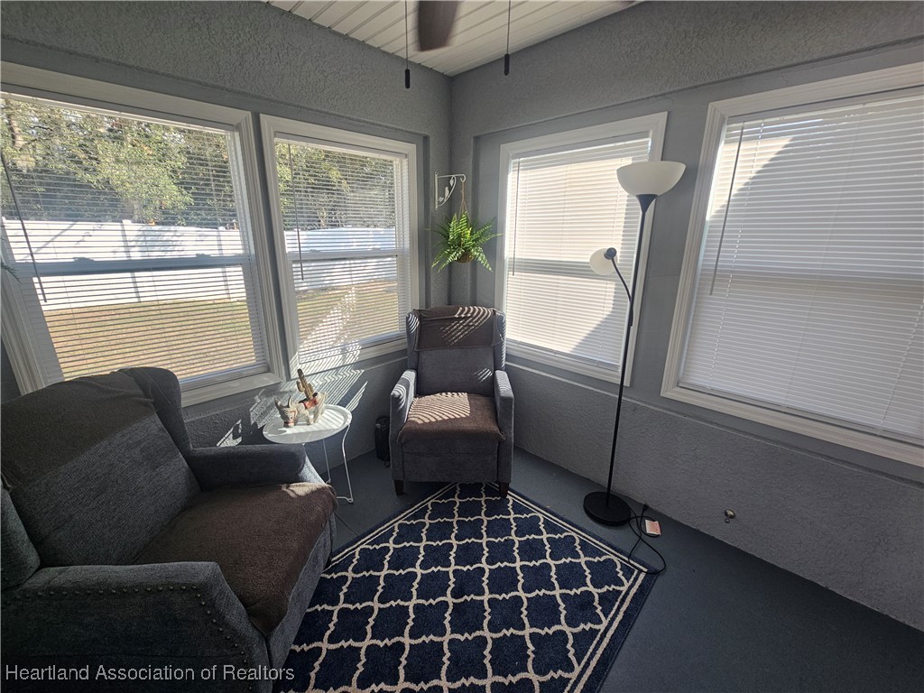 2950 North Sedgewick Road Avon Park, FL 33825 - Photo 11 of 16 a living room with furniture and a floor to ceiling window