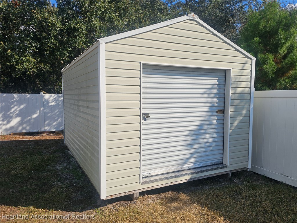 2950 North Sedgewick Road Avon Park, FL 33825 - Photo 14 of 16 a view of a white house with a small yard