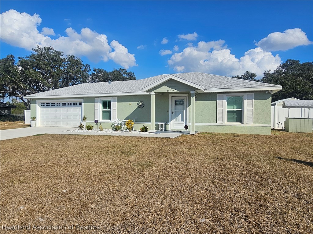 2950 North Sedgewick Road Avon Park, FL 33825 - Photo 15 of 16 a front view of a house with garden