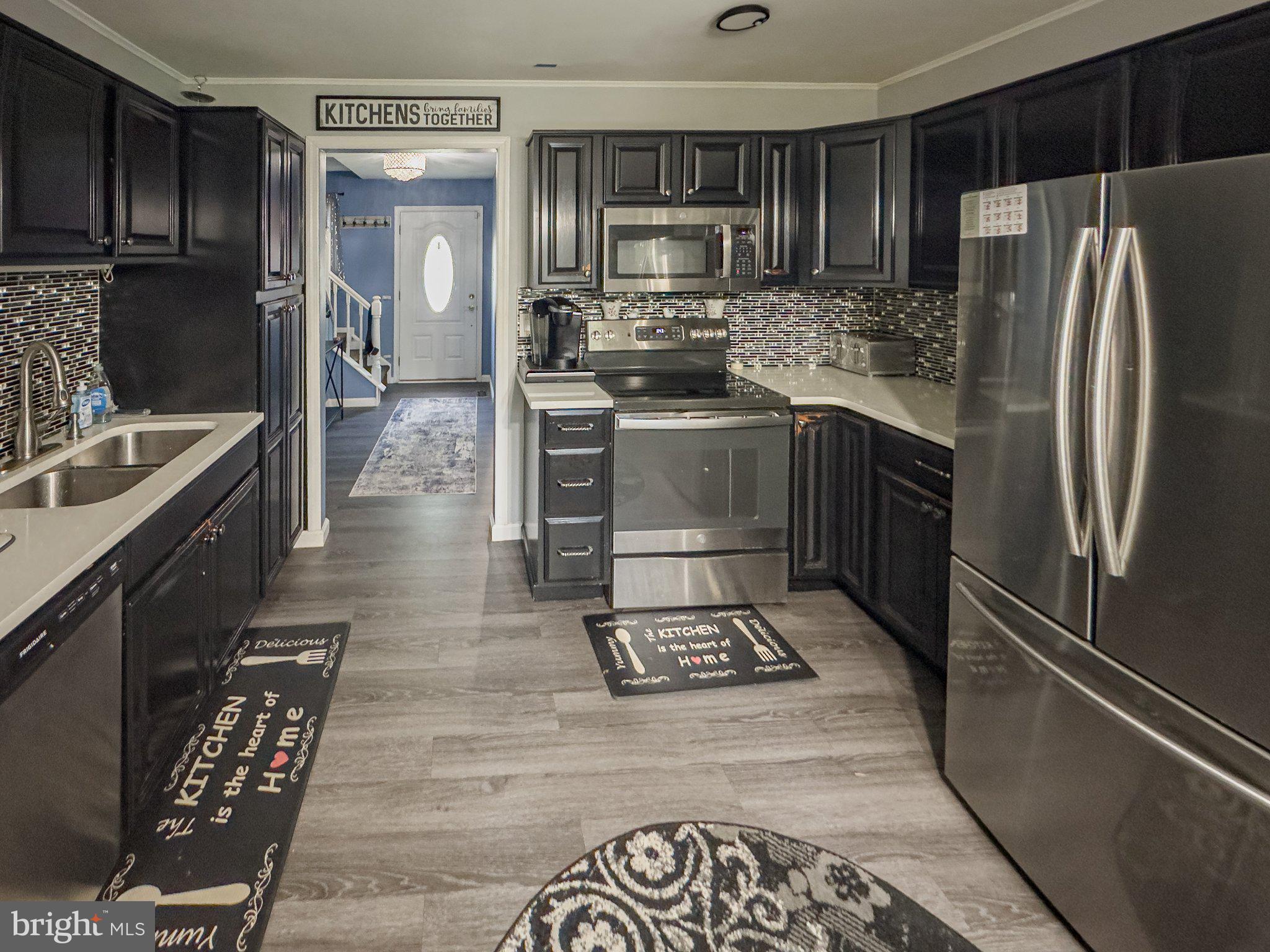57 Tarnsfield Road Westampton, NJ 08060 - Photo 3 of 24 Sleek modern kitchen with dark cabinetry.