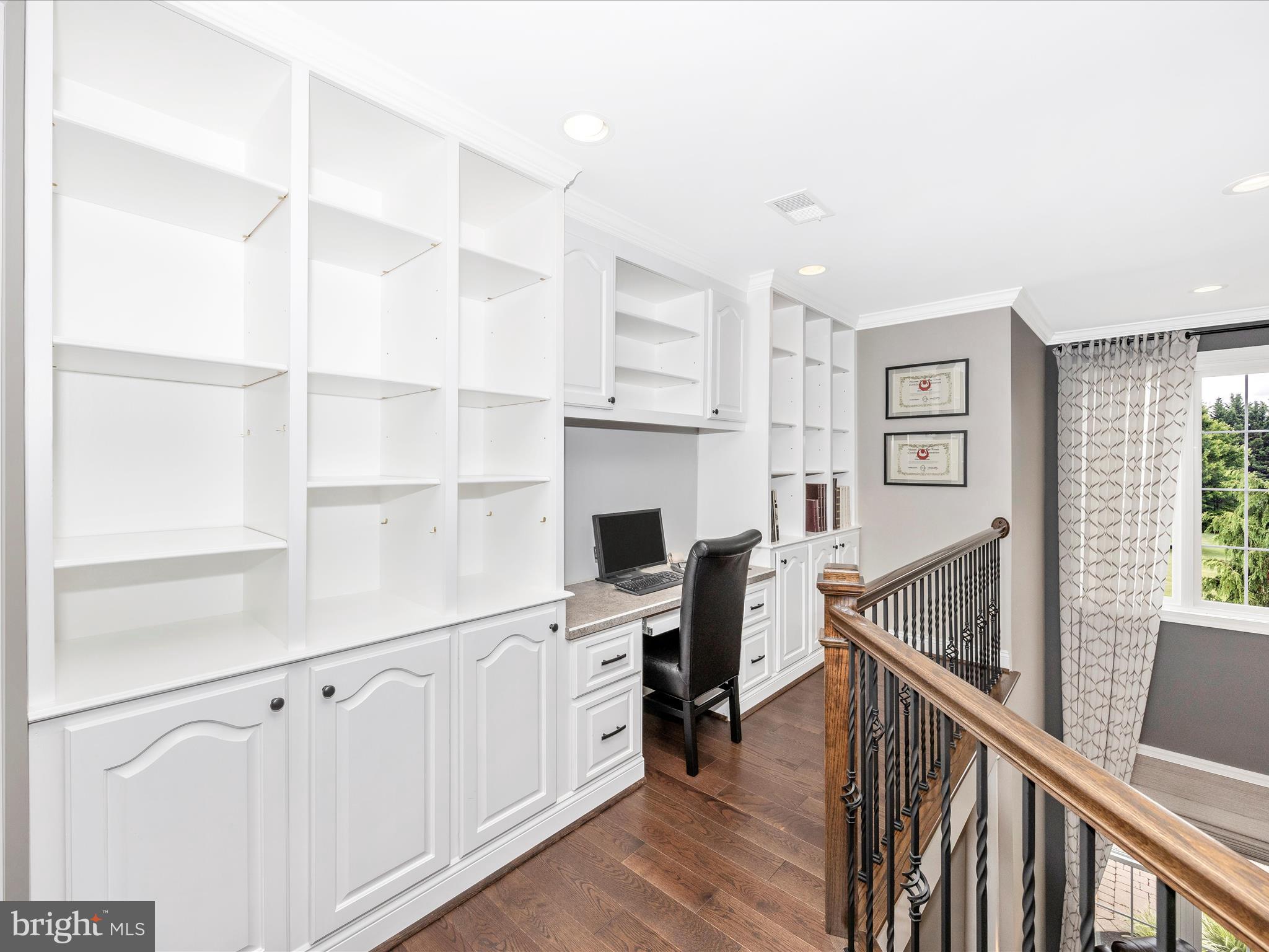 1865 Florence Road Mount Airy, MD 21771 - Photo 111 of 144 a view of a hallway with workspace and wooden floor