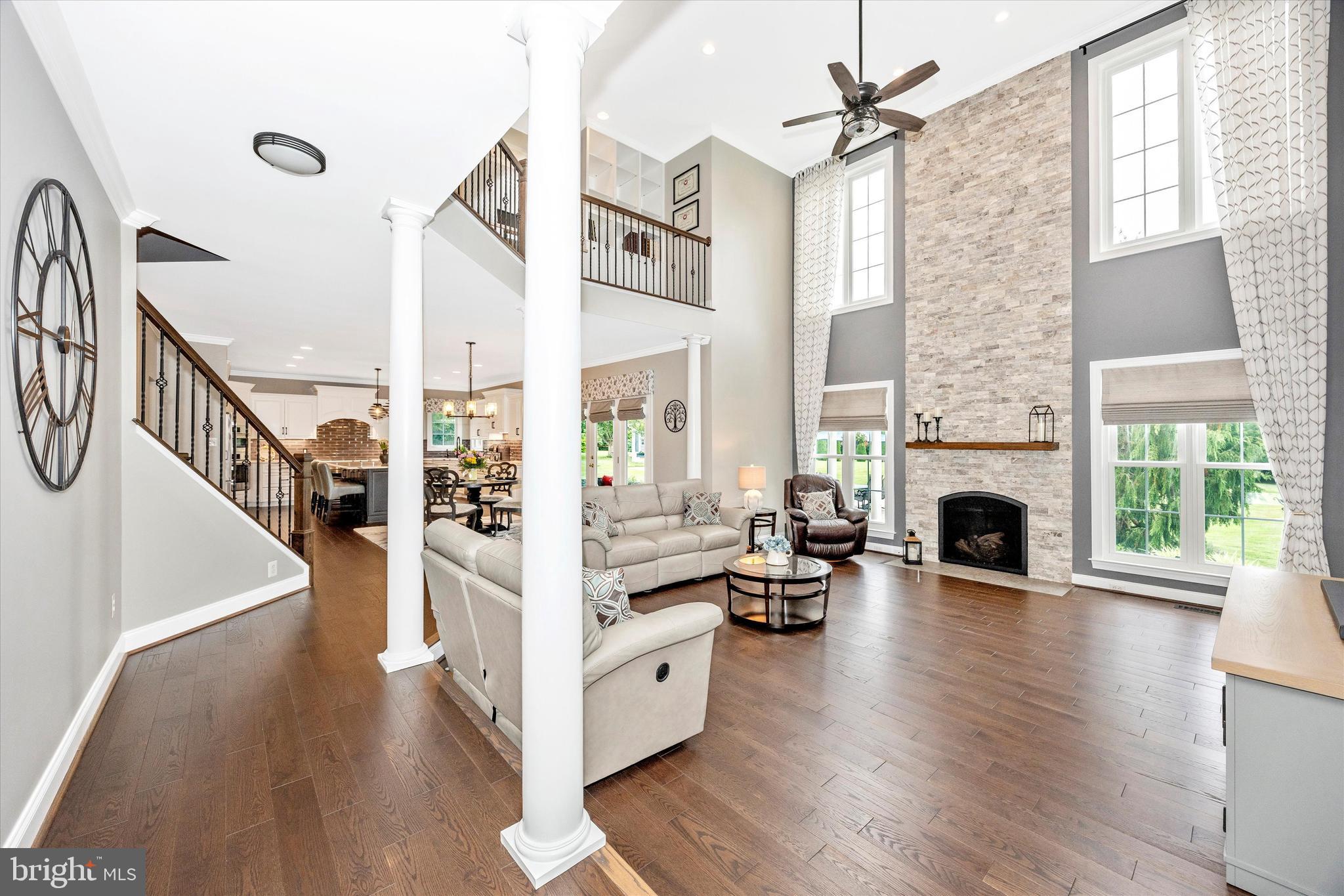 1865 Florence Road Mount Airy, MD 21771 - Photo 12 of 144 a view of a livingroom with furniture fireplace wooden floor and windows