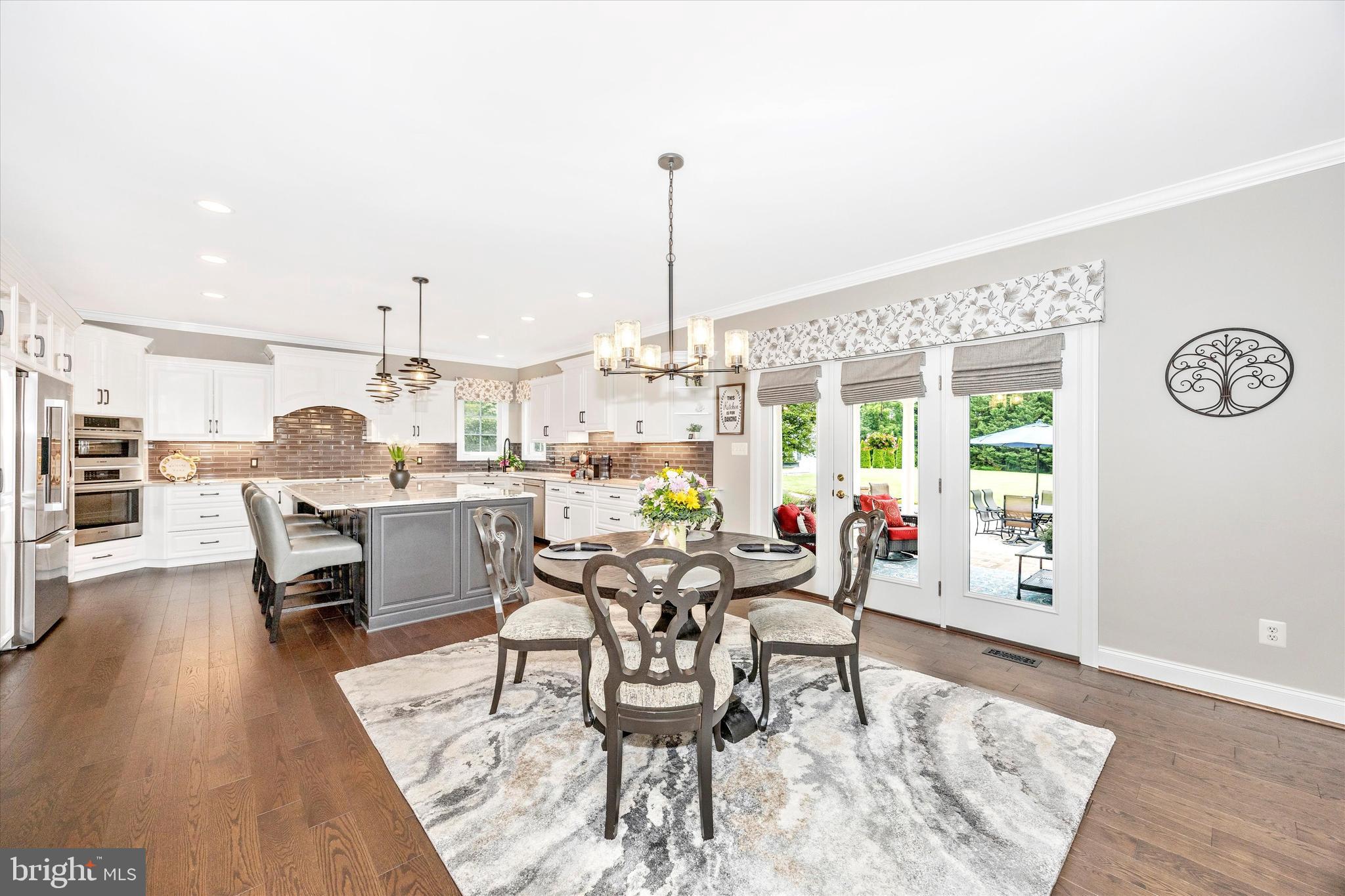 1865 Florence Road Mount Airy, MD 21771 - Photo 17 of 144 a dining room with furniture a chandelier and wooden floor