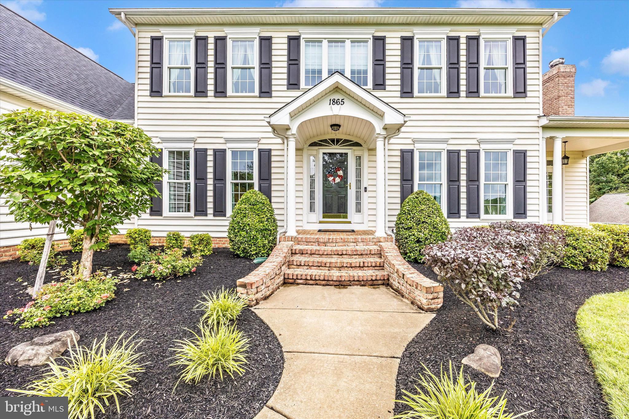 1865 Florence Road Mount Airy, MD 21771 - Photo 2 of 144 a front view of a house with a garden
