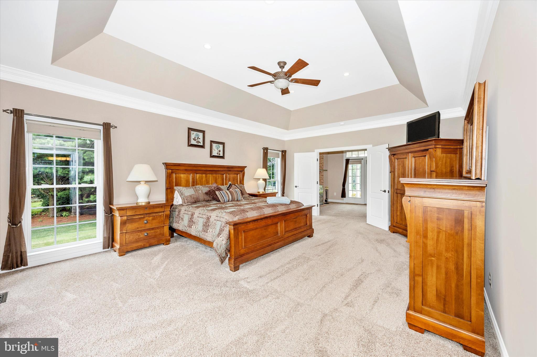 1865 Florence Road Mount Airy, MD 21771 - Photo 27 of 144 a spacious bedroom with a bed and a chandelier