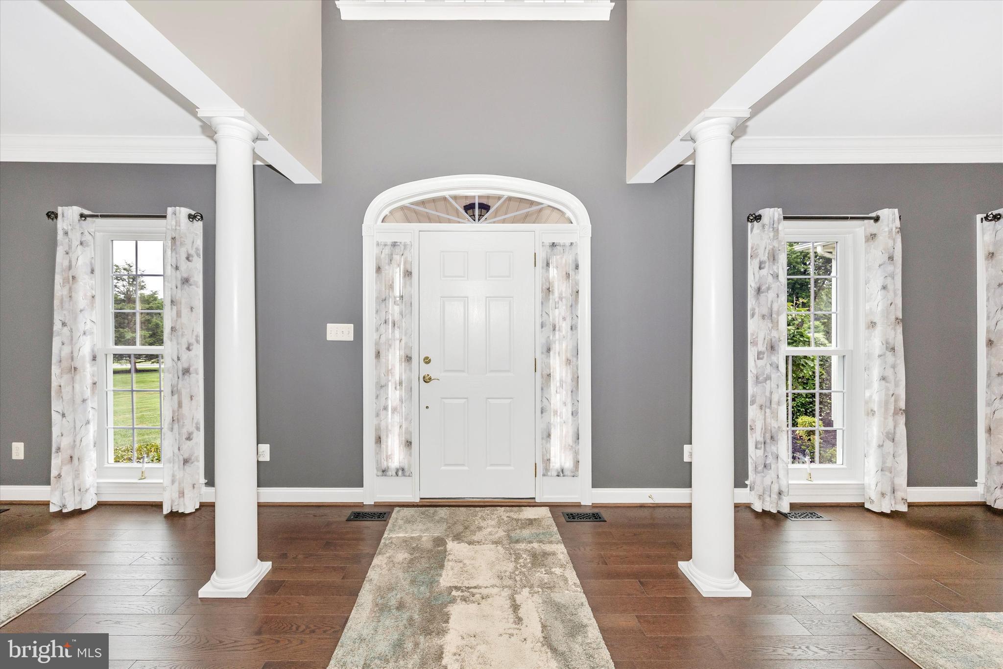 1865 Florence Road Mount Airy, MD 21771 - Photo 3 of 144 a view of a hallway with wooden floor and windows