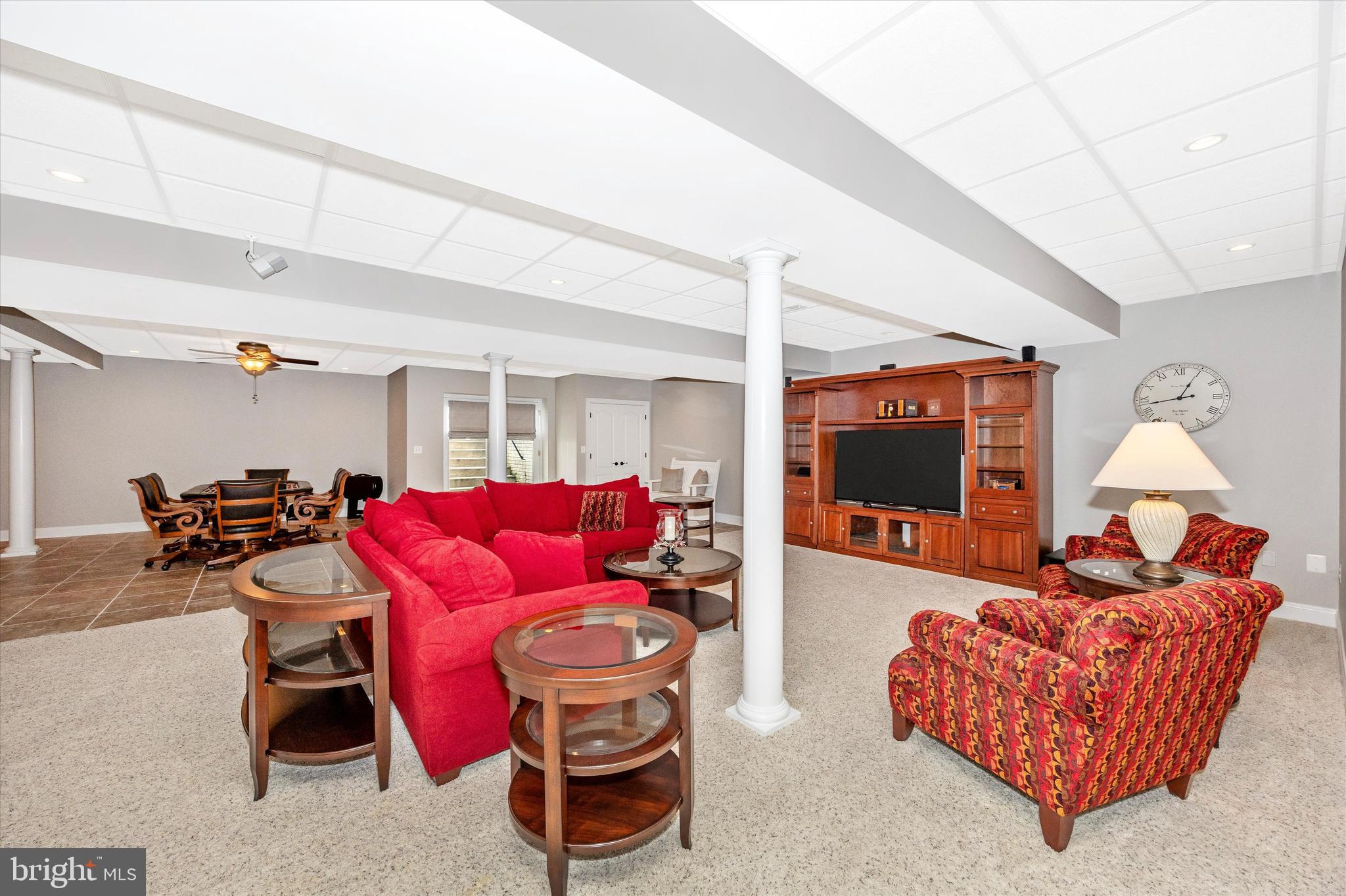 1865 Florence Road Mount Airy, MD 21771 - Photo 42 of 144 a living room with furniture a flat screen tv and a lamp