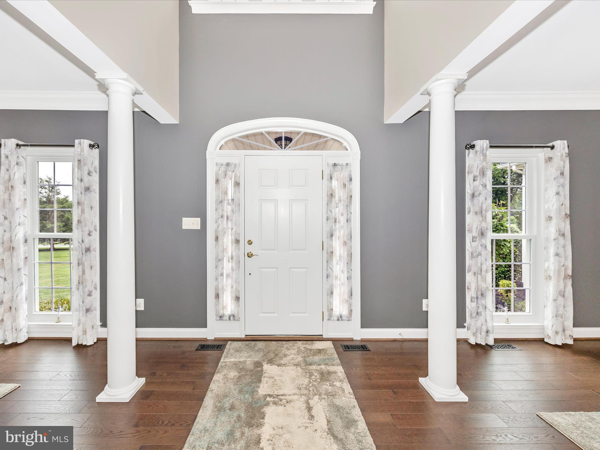 1865 Florence Road Mount Airy, MD 21771 - Photo 75 of 144 a view of a hallway with wooden floor and windows