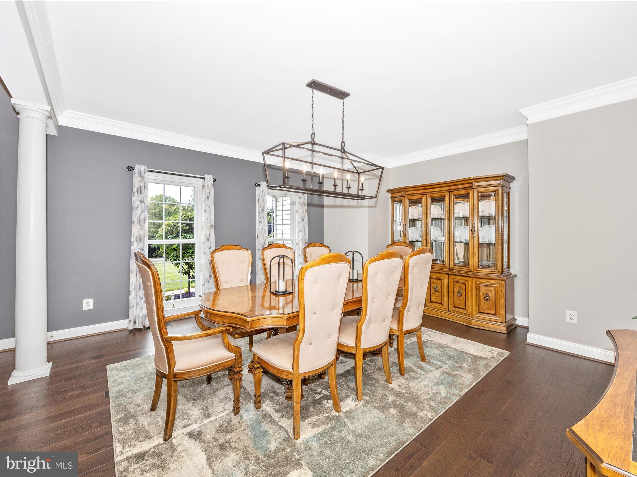 1865 Florence Road Mount Airy, MD 21771 - Photo 82 of 144 a dining room with furniture a chandelier and wooden floor