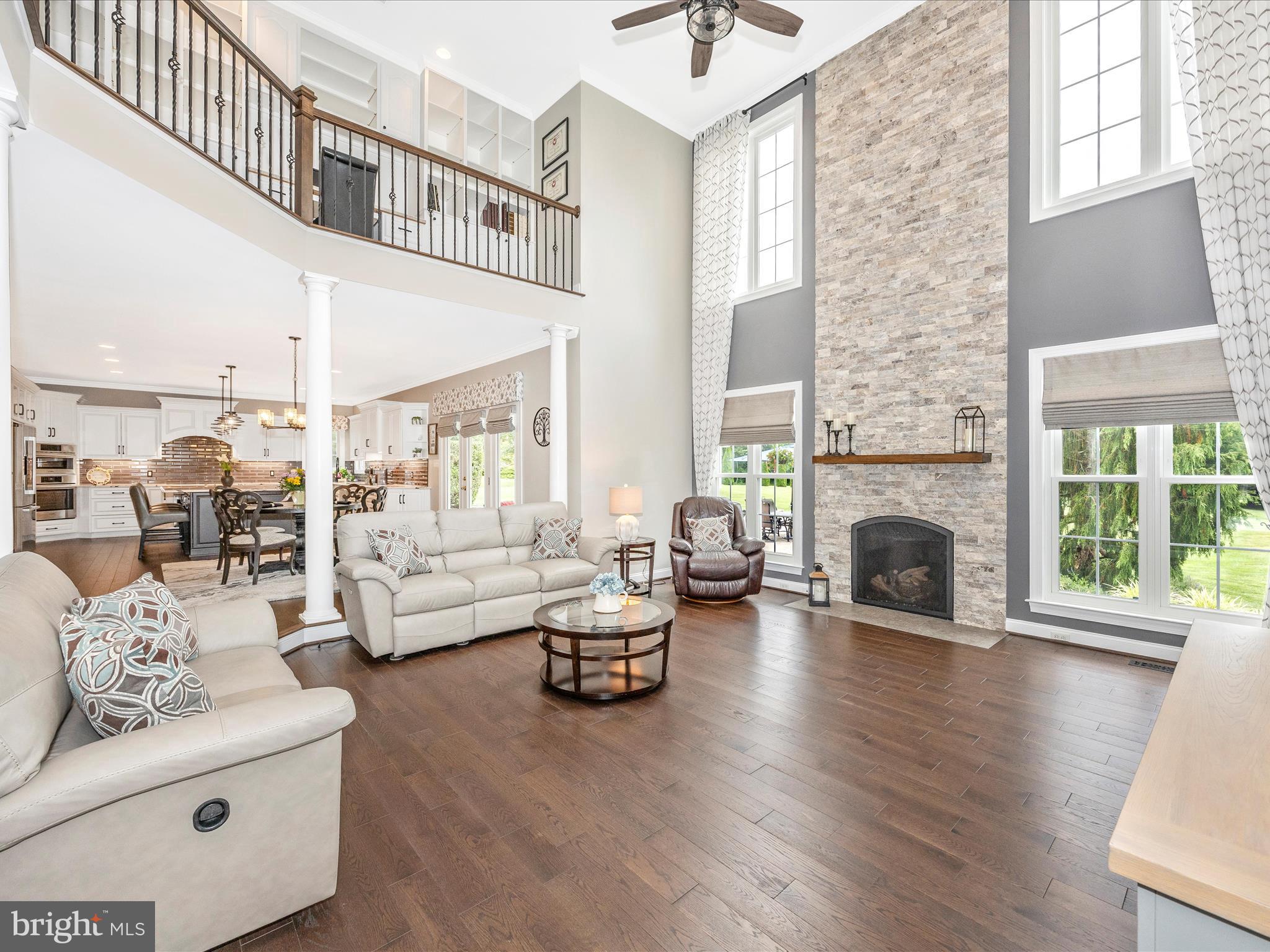 1865 Florence Road Mount Airy, MD 21771 - Photo 85 of 144 a living room with furniture a fireplace and a floor to ceiling window