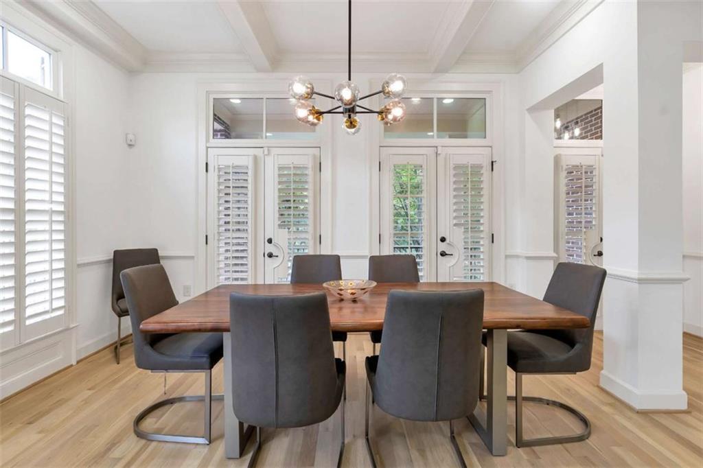 201 Riversgate Drive Atlanta, GA 30339 - Photo 12 of 69 a view of a dining room with furniture a chandelier and wooden floor