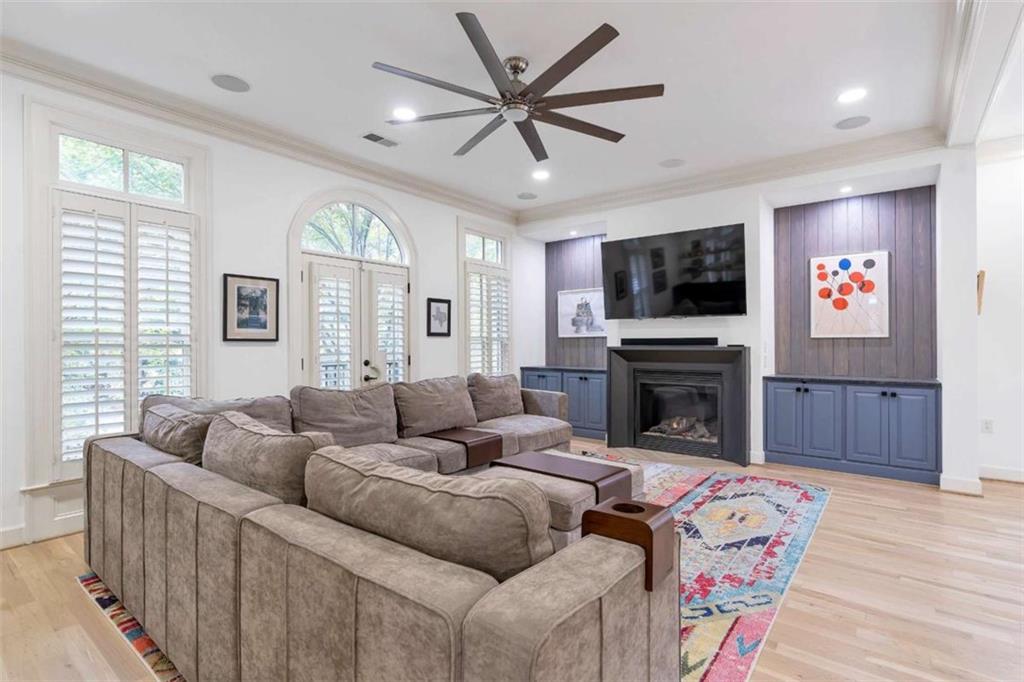 201 Riversgate Drive Atlanta, GA 30339 - Photo 17 of 69 a living room with furniture a flat screen tv and a fireplace