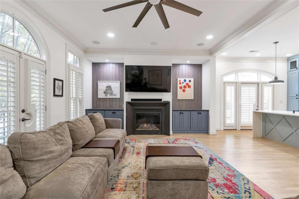 201 Riversgate Drive Atlanta, GA 30339 - Photo 19 of 69 a living room with furniture a flat screen tv and a fireplace