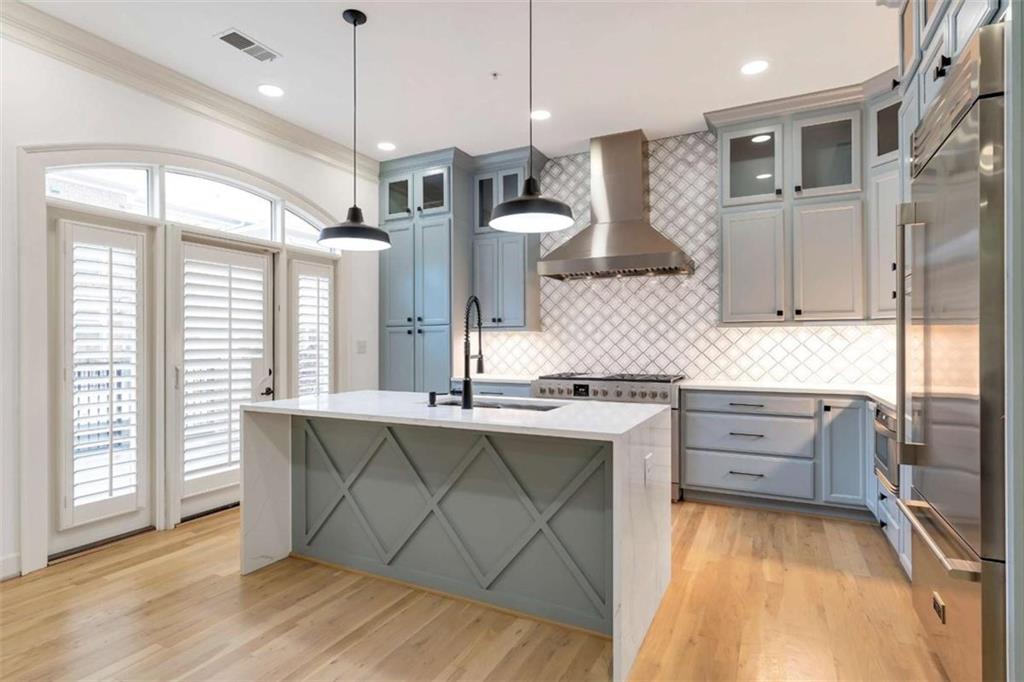 201 Riversgate Drive Atlanta, GA 30339 - Photo 24 of 69 a kitchen with stainless steel appliances granite countertop a stove a sink and a refrigerator