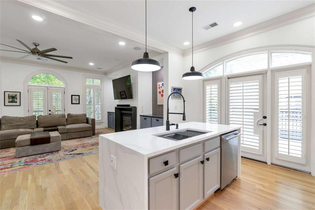 201 Riversgate Drive Atlanta, GA 30339 - Photo 28 of 69 a large kitchen with kitchen island a large counter space a sink appliances and a large window