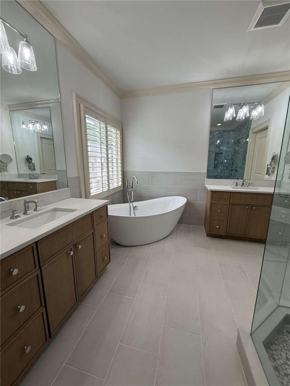 201 Riversgate Drive Atlanta, GA 30339 - Photo 36 of 69 a spacious bathroom with a double vanity sink a large mirror and bathtub