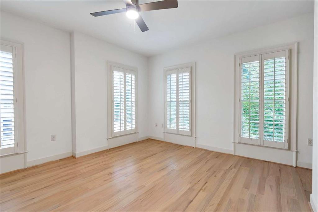 201 Riversgate Drive Atlanta, GA 30339 - Photo 50 of 69 a view of an empty room with wooden floor and a window