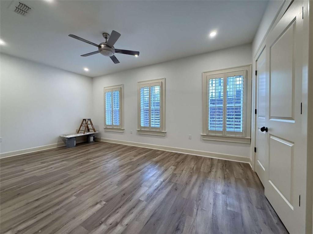 201 Riversgate Drive Atlanta, GA 30339 - Photo 56 of 69 a view of empty room with wooden floor and fan