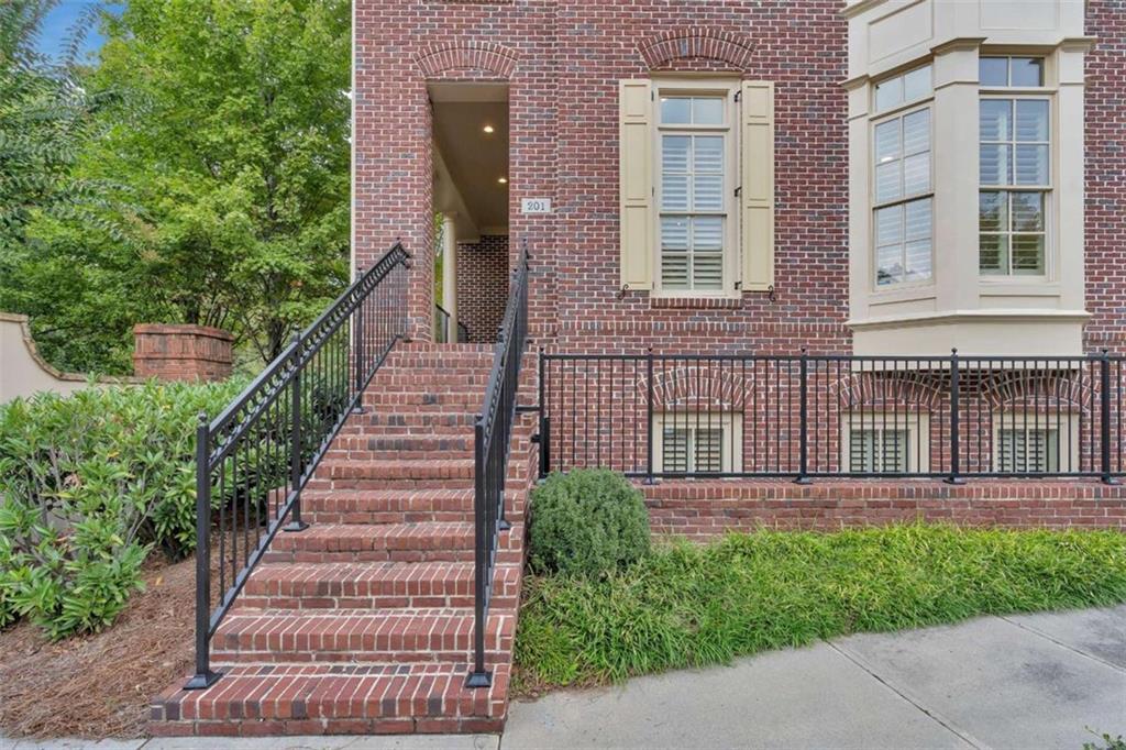 201 Riversgate Drive Atlanta, GA 30339 - Photo 63 of 69 a front view of a house with a garden
